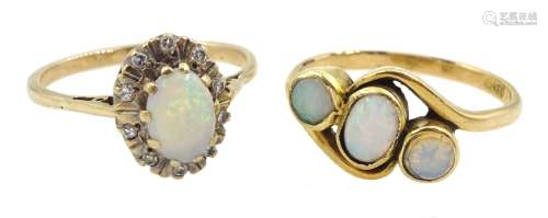 Gold three stone opal ring