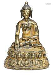 A Tibetan gilt bronze figure of Buddha Shakyamuni. 17th cent...