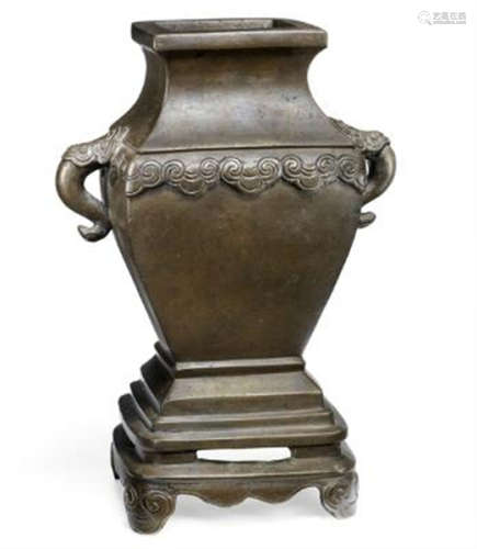 A Chinese patinated bronze vase of foursided baluster form, ...