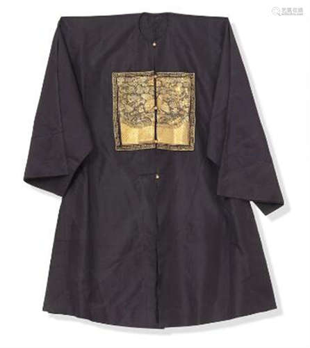 A Chinese dark blue silk robe with Mandarin badges on front ...