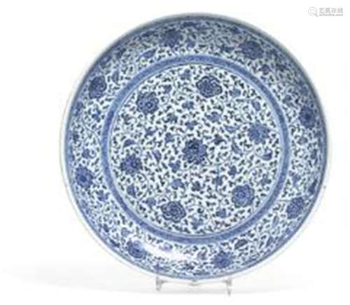 A Chinese porcelain Ming style dish decorated in underglaze ...