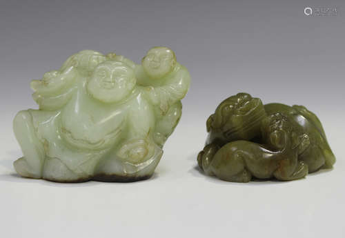 A Chinese pale celadon jade figure group of a seated immorta...