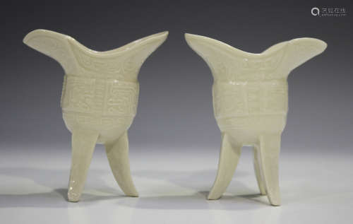 A pair of Chinese blanc-de-Chine porcelain archaistic jue ve...