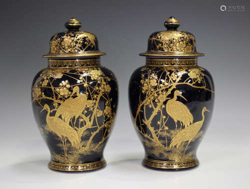 A pair of Japanese Satsuma earthenware vases by Kusube, Meij...
