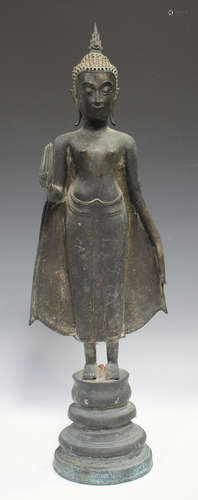 A Thai bronze figure of a standing Buddha, probably 20th cen...