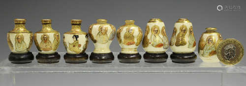 A set of eight Japanese Satsuma earthenware miniature vases,...