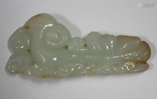 A Chinese pale celadon jade pendant, carved and pierced in t...