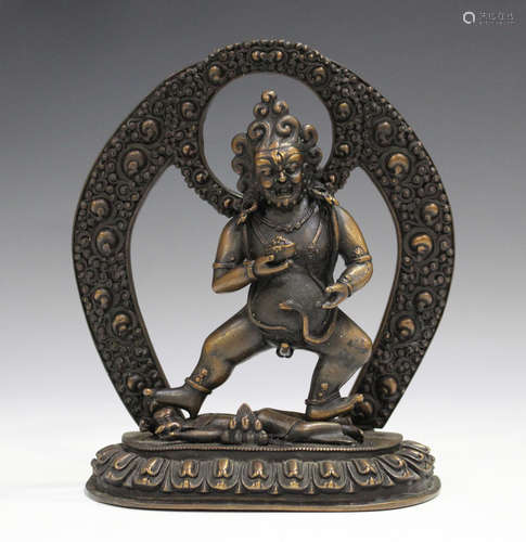 A Sino-Tibetan brown patinated sectional figure of Jambhala,...