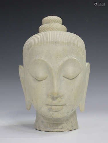 A Thai carved marble head of Buddha, 20th century, carved wi...