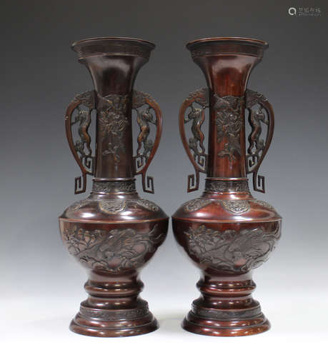 A pair of Japanese brown patinated bronze two-handled vases,...