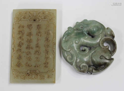 A Chinese jade circular pendant, carved and pierced with a d...