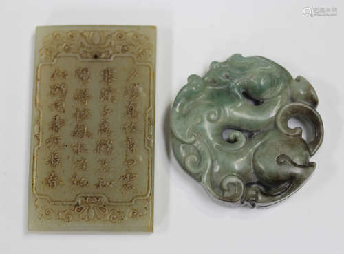 A Chinese jade circular pendant, carved and pierced with a d...