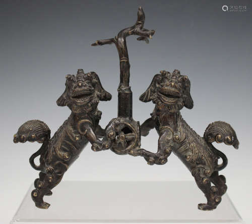 A Chinese brown patinated bronze jostick holder, probably Mi...
