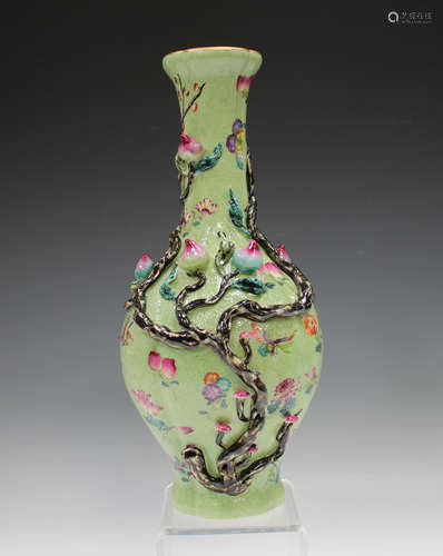 A Chinese famille rose enamelled green ground porcelain vase...