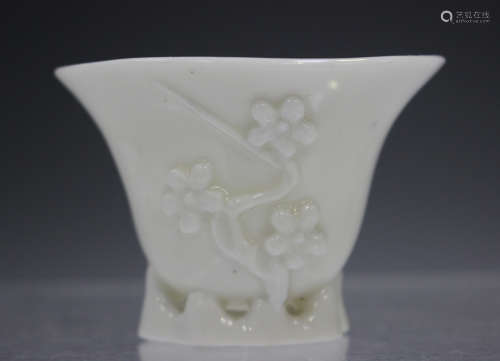 A Chinese blanc-de-Chine porcelain libation cup, Kangxi peri...