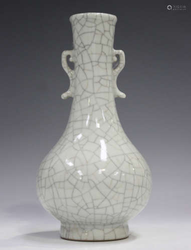 A Chinese Guan-type crackle glazed bottle vase, the globular...