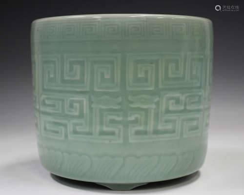 A Chinese celadon glazed porcelain brushpot, probably 20th c...