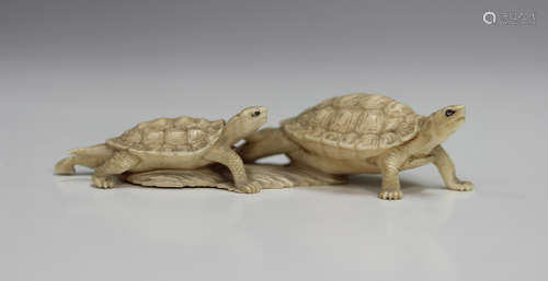 A Japanese carved ivory okimono figure group of two tortoise...