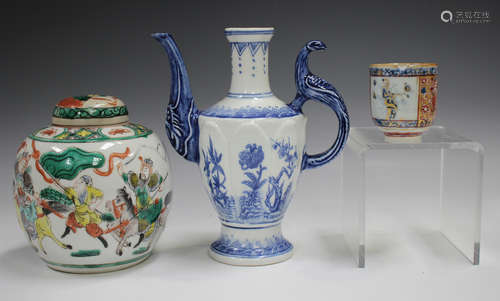 A Chinese 'clobbered' blue and white porcelain coffee cup, K...