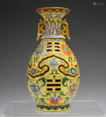 A Chinese famille rose enamelled yellow ground reticulated v...