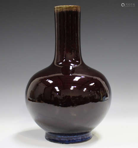 A Chinese flambé glazed porcelain bottle vase, mark of Yongz...