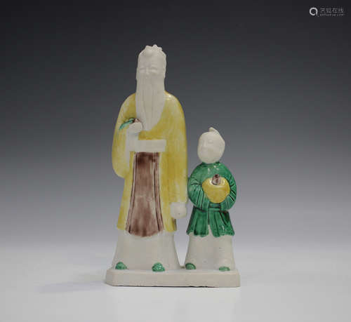 A Chinese famille verte enamelled biscuit porcelain figure g...