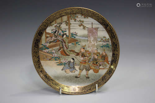 A Japanese Satsuma earthenware circular plate by Kozan, Meij...