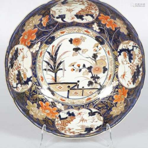 A large Japanese charger with Imari decor.