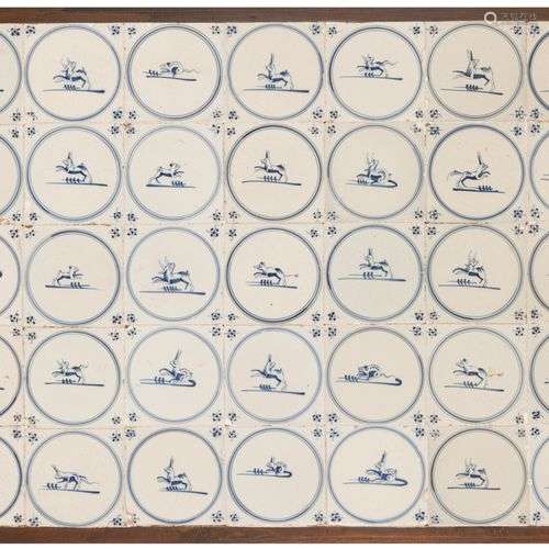 A set of (35) tiles in blue-and-white motif, depicting vario...