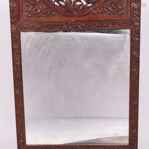 A mirror frame with Balinese carvings, Indonesia, 20th centu...