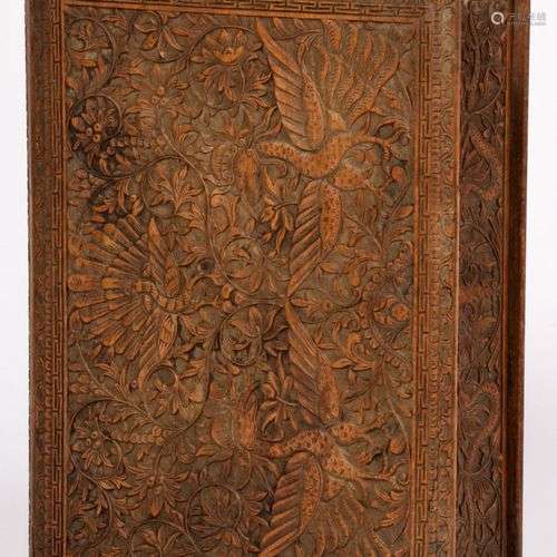 A richly carved Djati-wooden box in the shap of a book, Indo...