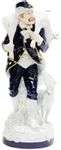 A porcelain figurine of a huntsman with his dog. Royal Dux A...