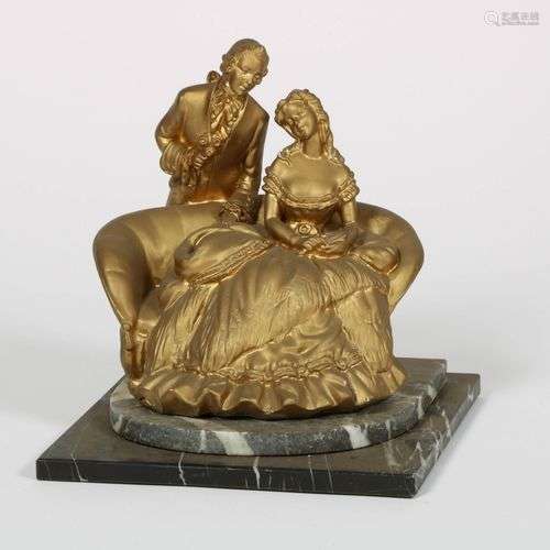 A gilt sculpture of a loving couple, 20th century.