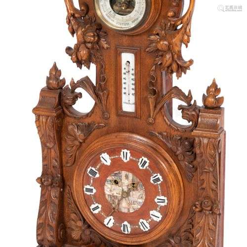 A richly carved wooden clock, Germany, 20th century.