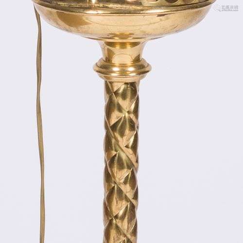 A brass easter-candleholder, fitted as a floorlamp, 20th cen...