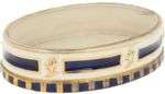 A porcelain charger decorated with cobalt blue and gold moti...