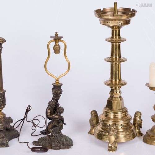 A lot comprising (4) bronze candlesticks, including one in E...