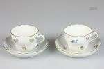 A lot of (2) porcelain cups and saucers with floral decor. M...