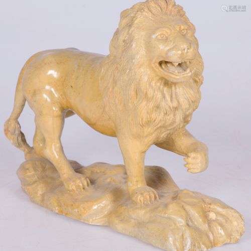 A stone sculpture of a walking lion, France, 2nd quarter 20t...