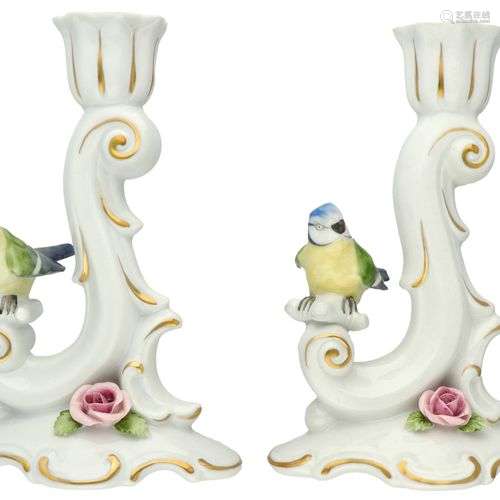 A set of (2) porcelain candlesticks decorated with birds and...