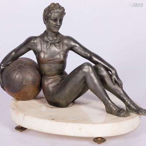 A bronze statuette of a seated turning lady with large ball,...