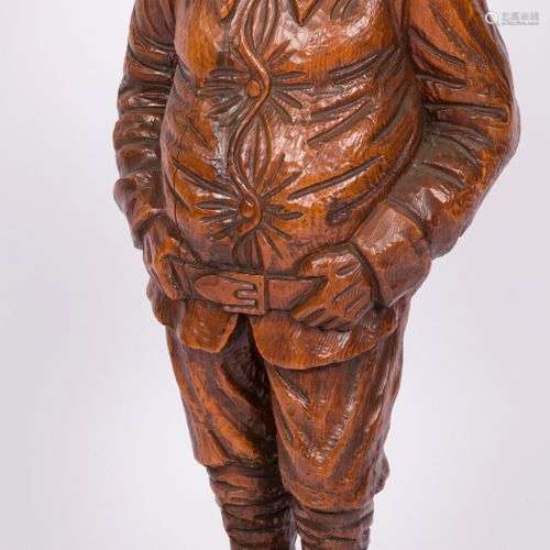 A pinewood sculpture of a fisherman, France, 1st half 20th c...