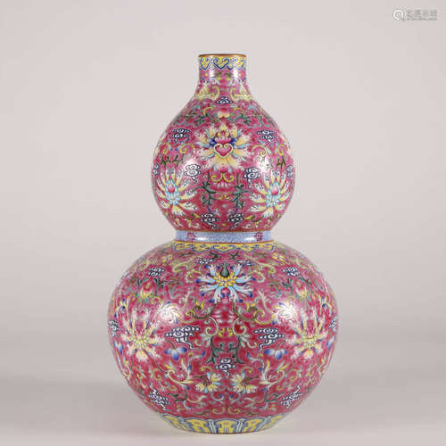 A Famille Rose Millefleurs Double Gourd Shaped Vase