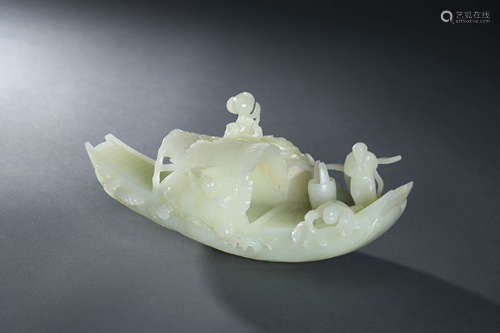 A Carved Hetian White Jade Boat Ornament