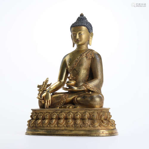 A Gilt Bronze Statue Of Medicine Buddha