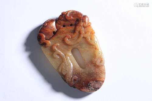 A Carved Russet Jade Chi Dragon Pendant