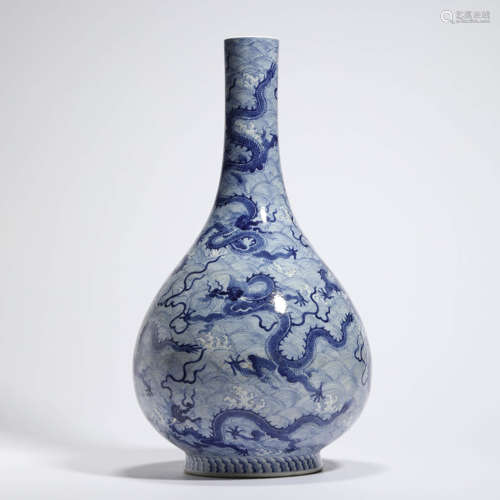 A Blue And White Dragon And Wave Bottle Vase