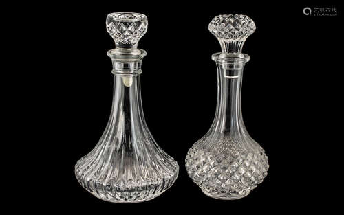 Two Cut Glass Decanters, both with decorative stoppers, each...