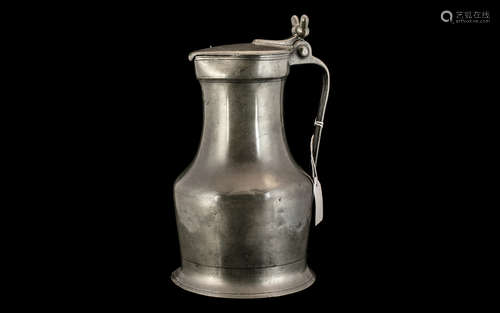 18th Century Pewter Flagon of large size, the handle grip wi...