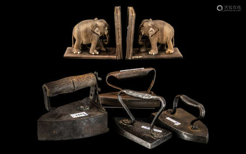 Four Antique French Cast Flat Irons, with a pair of teak ele...